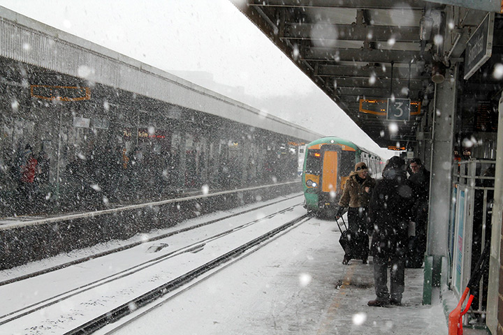 Europe snow: Commuters wait for trains in freezing conditions at Haywards Heath 