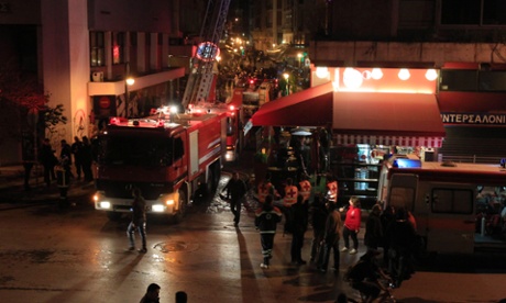 A building in which the private office of the deputy development minister Stavros Kalafatis is located is surrounded by firefighters and paramedics after an explosion