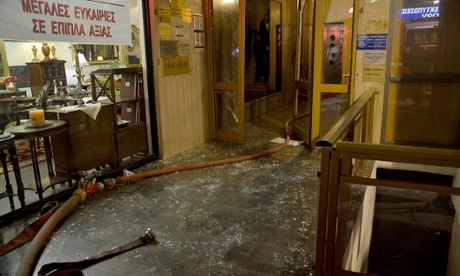 The entrance to the office of New Democracy Party MP Giorgos Orfanos after it was attacked