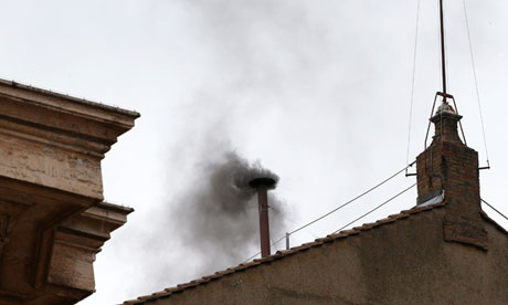Black smoke billows from the chimney of the Sistine Chapel on the morning of 13 March 2013.