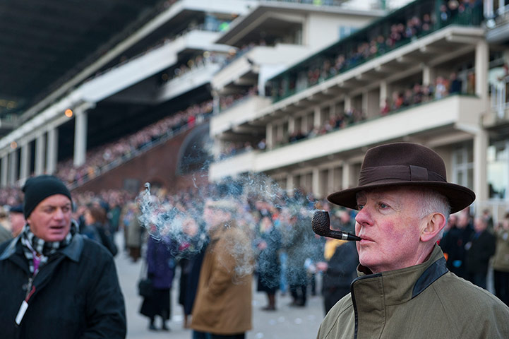 Cheltenham day 2: Pipe smoking in front of the main grandstand at Cheltenham