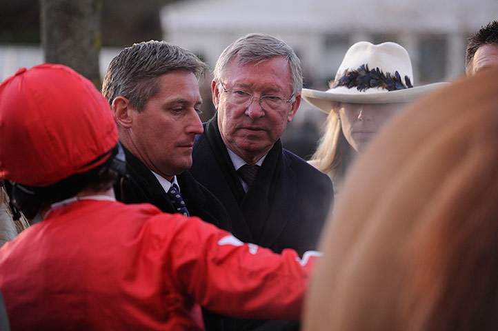 Cheltenham day 2: Alex Ferguson listens to his jockey Andrew Tinkler