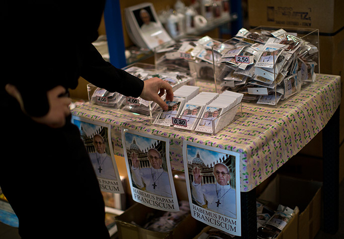 Pope Francis first day: Souvenirs showing the new Pope Francis are on sale in a shop