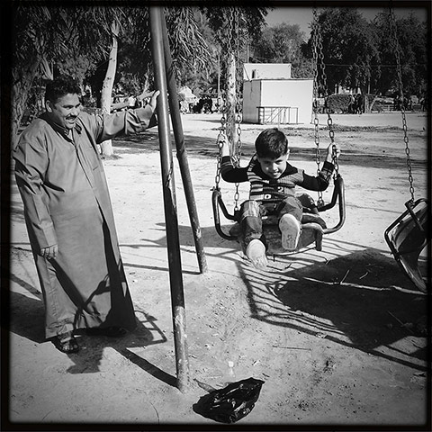 Baghdad: A father plays with his son in a Baghdad park