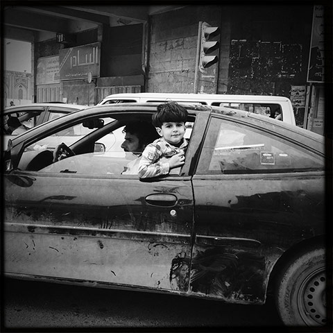 Baghdad: A child stares out of a car window in central Baghdad 