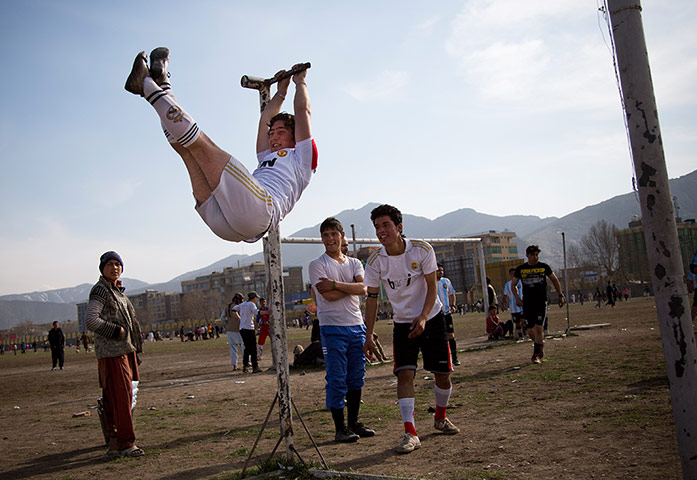 24 hours: Afghan youths warm up before playing football
