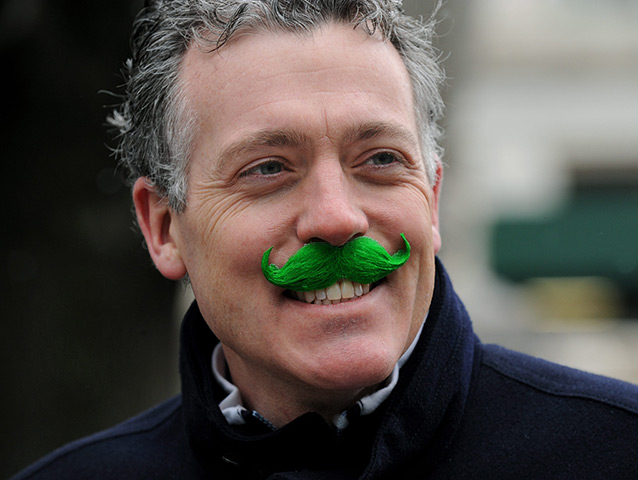St Patrick's day: A parade-goer wears a green moustache in New York