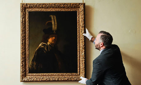 The newly discovered Rembrandt self-portrait is inspected by the curator David Taylor at Buckland Abbey. Photograph: Ben Birchall/PA