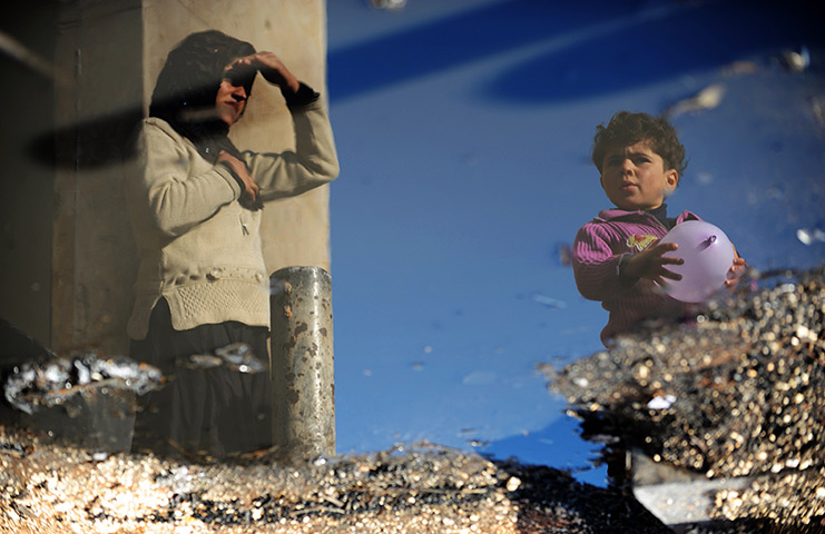 24 hours: Syria: A Syrian internally-displaced woman at a camp