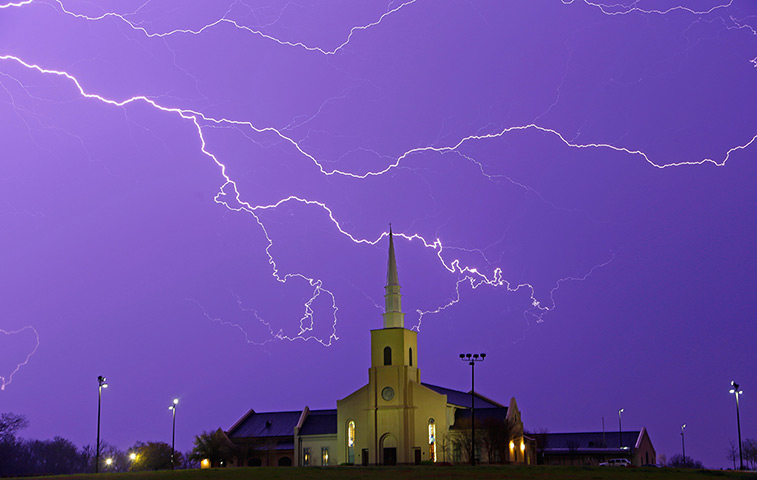 24 hours in pictures: Lightning steaks across the sky in Alabama