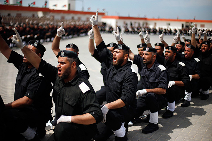24 hours in pictures: Members of Hamas security forces take part in a graduation 