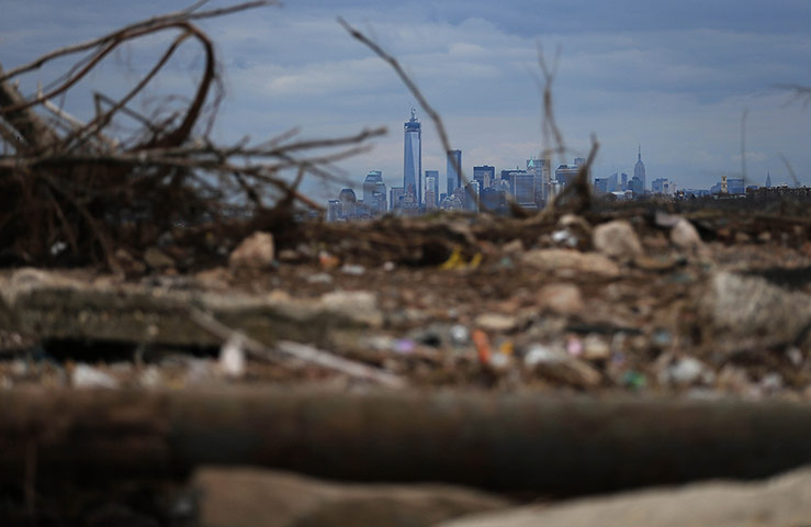 24 Hours: Debris on a closed beach damaged by floods from Hurricane Sandy in New York