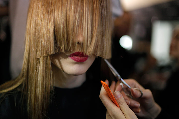 24 Hours: A model has her hair cut backstage at Paris Fashion Week