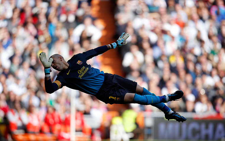 classico: Barcelona's goalkeeper Valdes tries to make a save 