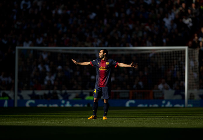 clasico 2: Javier Mascherano tries to organise his midfield