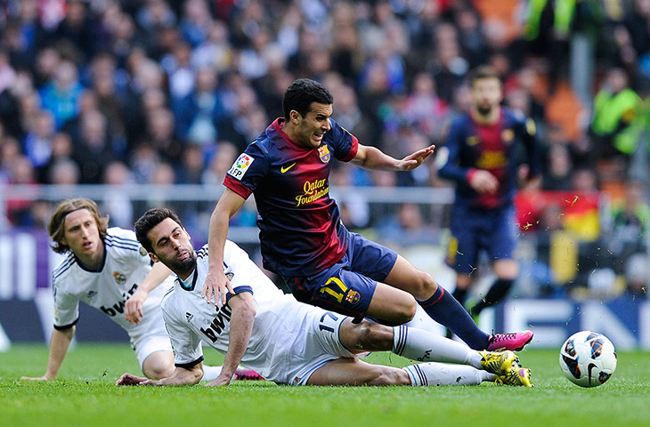 clasico 2: Pedro Rodriguez is brought down by Alvaro Arbeloa