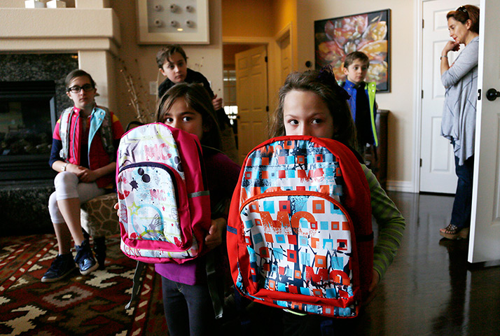 24 hours: Aurora, Colorado: Girls demonstrate how to use bulletproof backpacks as shields 
