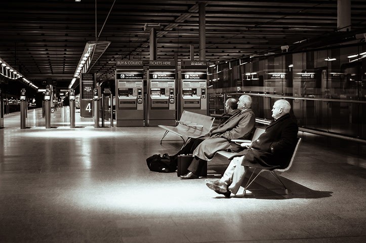 Your pictures - station: black and white picture of St Pancras station at night with three men