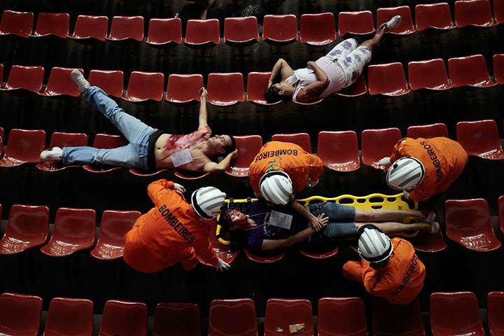 24 hours in pictures: Paramedics and firefighters train during a simulated emergency situation