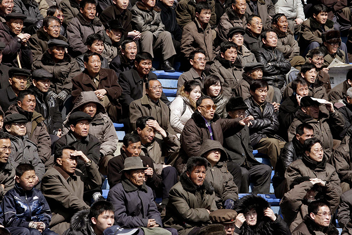 24 hours in pictures: Spectators watch a soccer matchat the Kim Il Sung Stadium, North Korea