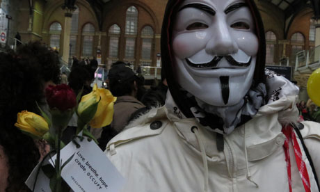 Occupy London celebrate May Day by handing out flowers in Liverpool St