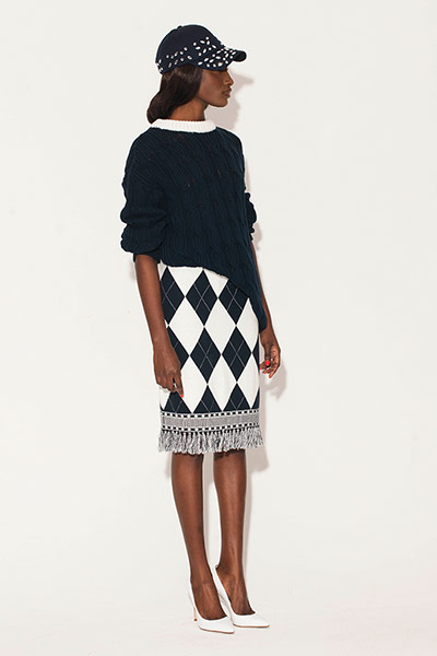 All Ages: Pencil Skirts: Model wears black and white diamond print skirt, black top and black cap