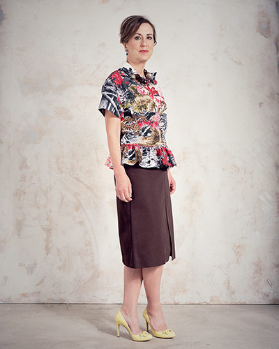 Kirsty Wark: Kirsty Wark wearing peplum flowery patterned top and brown slit-front skirt
