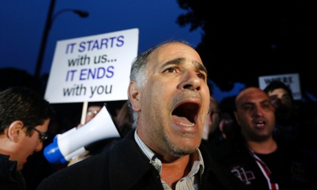 A protester shouts slogans during a rally by employees of Cyprus Popular Bank outside the parliament in Nicosia March 21, 2013.