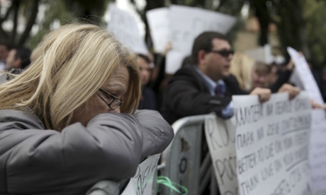 People protest outside the Cypriot Parliament on March 22, 2013 in the capital Nicosia.