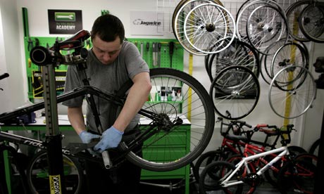 man repairing bike