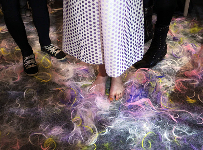 20 photos: A model undergoes preparations backstage