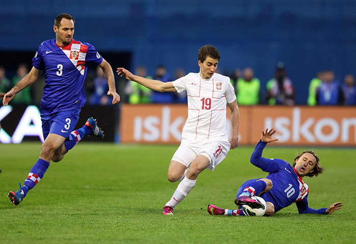 other world cup games: Luka Modric nicks the ball away from Filip Duricic