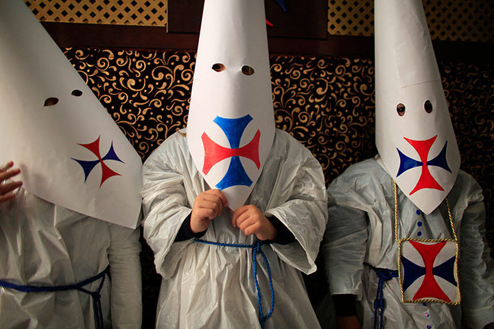 24 hours: Children wearing hoods as penitentsin Seville, Spain