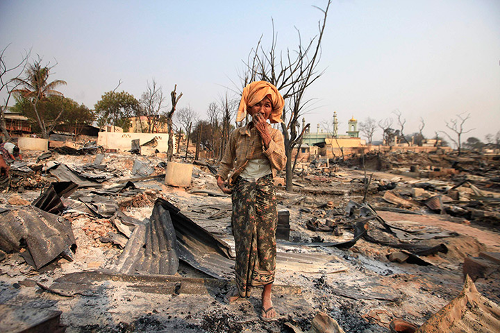 Burma violence: 23 March: A Buddhist woman cries for her home