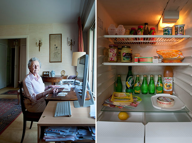 Big Picture - Fridges: elderly woman sitting behind desk with fridge of food