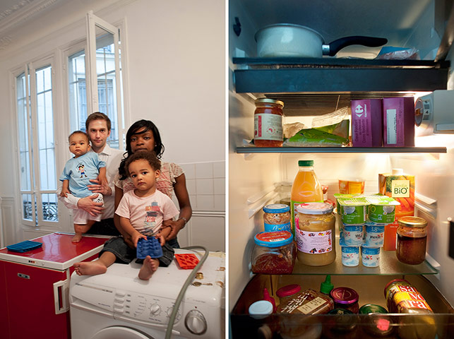 Big Picture - Fridges: white man and black woman and two children stand with pic of open fridge