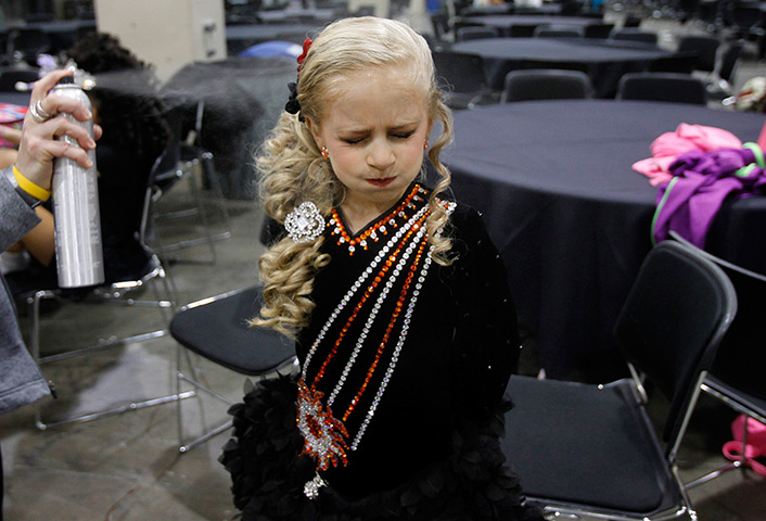 FTA Jessica Rinaldi: A girl holds her breath as she has her hair done backstage