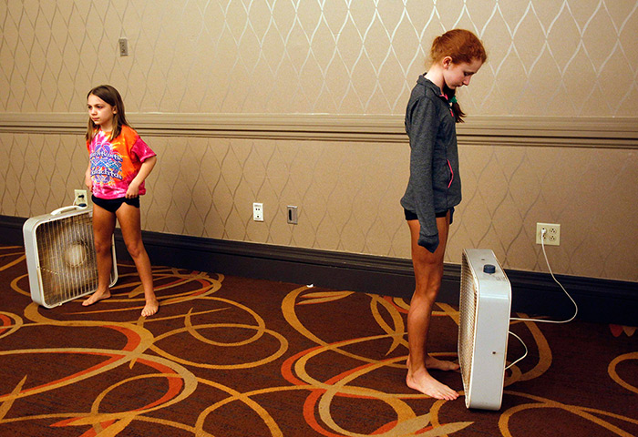 FTA Jessica Rinaldi: Girls stand next to fans as they wait for their spray tans to dry 