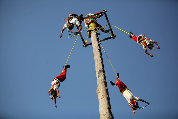 24 hours in pictures: Young Papantla Flyers perform at the Takilhsukut park