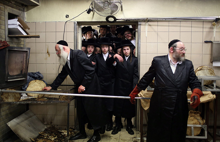 24 hours in pictures: ultra-Orthodox Jews wait in line to buy matzah