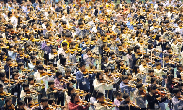 Imagine the noise! Children play the violin during the opening concert of the 16th Suzuki Method World Convention in Japan. Around 2,000 Japanese and foreign children displayed their skills during the opening concert.