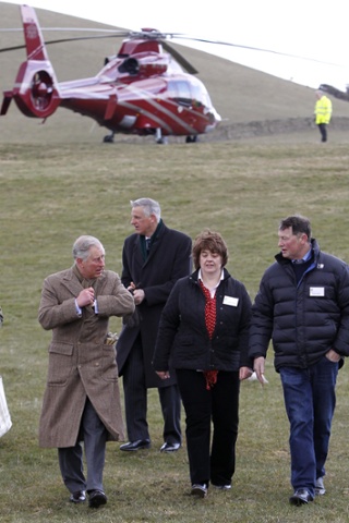 Flying visit: The Prince of Wales arrives by helicopter during a visit to the Land Rover Experience driver training programme at Kitridding Farm, Lupton, Cumbria.