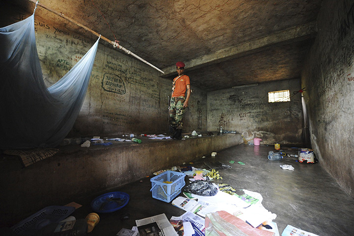 24 hours: Bangui, Central African Republic: A Seleka rebel checks a prison cell