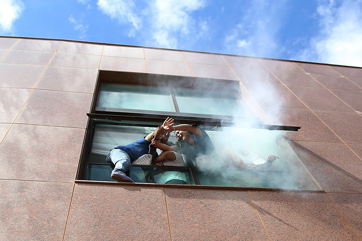 24 hours: Brasilia, Brazil: Volunteers in a fire simulation
