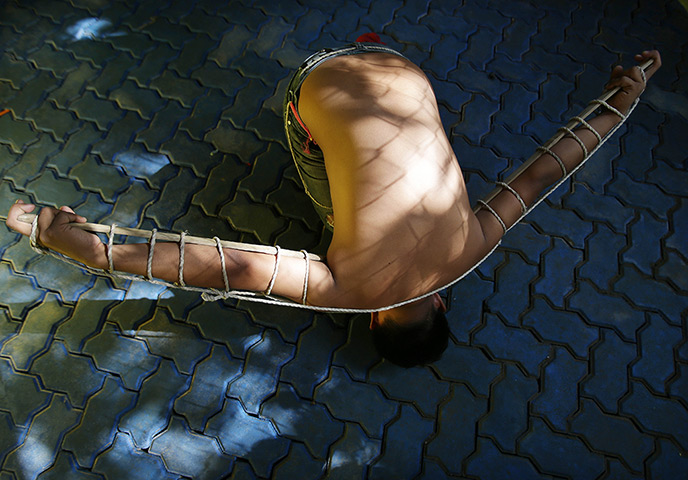 24 hours: Mandaluyong, Philippines: A penitent rests