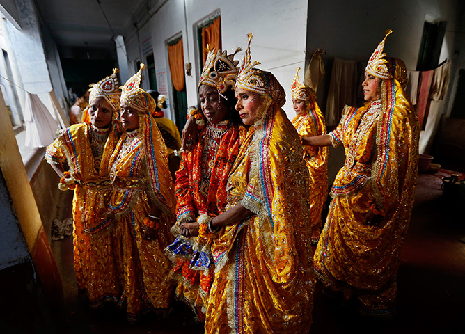 Holi festival: Indian widows dressed in costume wait to perform