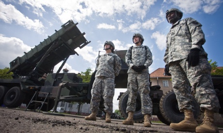 US soldiers stand in front of a Patriot missile battery at an army base in the northern Polish town of Morag in 2010.