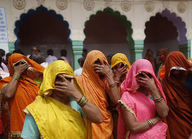 24 hours in pictures: Mathura, India: Women cover their faces during 