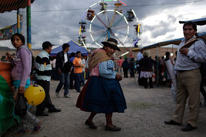 24 hours in pictures: Ayacucho, Peru: An indigenous woman walks at Canaan fair,