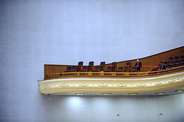 24 hours in pictures: Two security officers watch over the opening session 